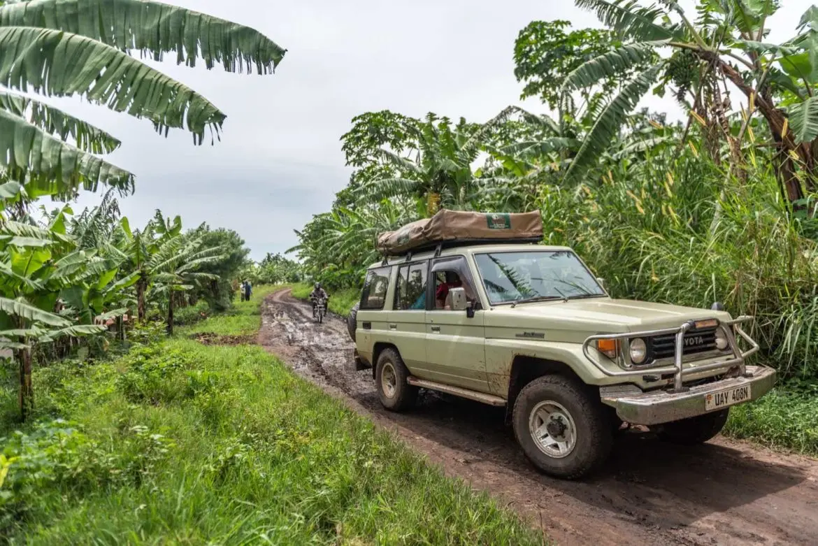 4x4 car hire Bwindi Uganda on a muddy road to gorilla trekking trailhead