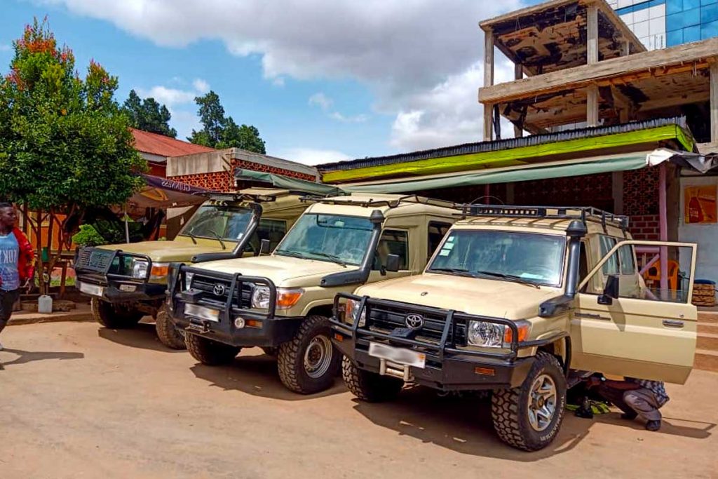 Car hire with driver Uganda safari vehicle parked near gorilla trekking lodge